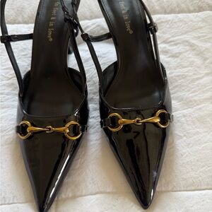 Chic Black Patent Leather Heels with Gold Accents